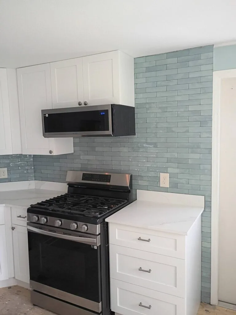 Island Lakes kitchen stainless range and surrounding white cabinetry