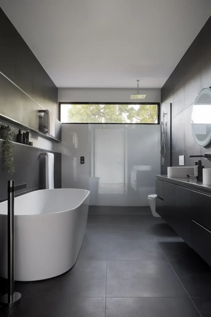 Renovated ensuite bathroom with walk-in shower and double vanity in River Heights, Winnipeg